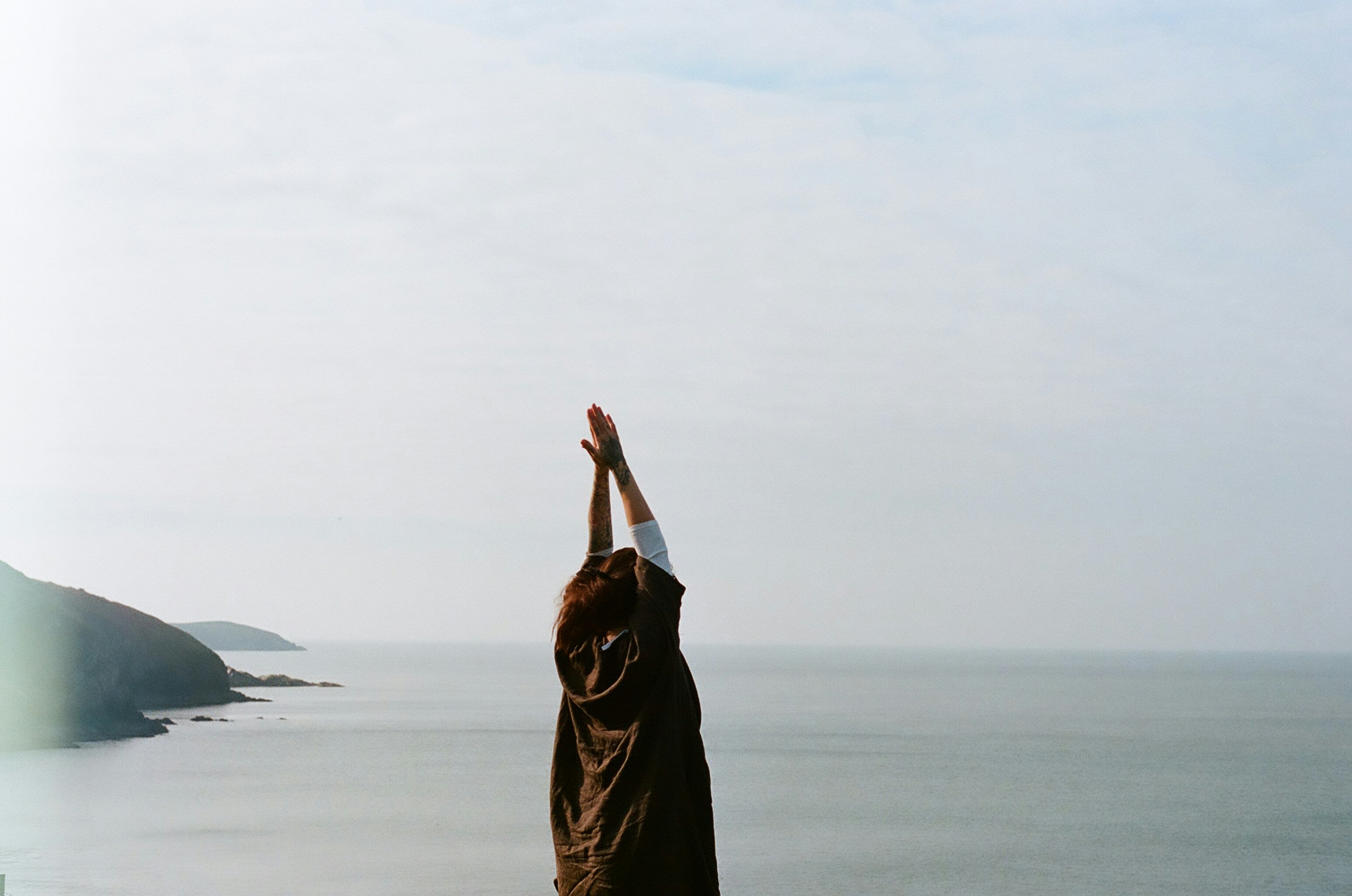 woman with hands in air